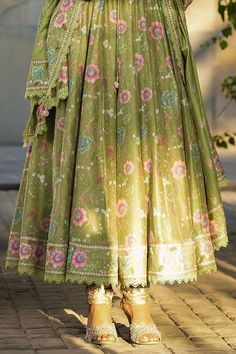 Dark green silk chanderi koti jacket style anarkali with all over floral prints and embroidery detailing. Paired with a churidar and dupatta with floral prints and lace border. - Aza Fashions Green Resham Embroidered Anarkali Set In Mulmul, Green Cotton Sharara With Sheer Dupatta, Green Mulmul Sharara With Zari Work, Green Mulmul Anarkali Set With Dabka Work, Green Mulmul Sharara With Dabka Work, Designer Green Anarkali Set In Mulmul, Green Salwar Kameez With Dupatta In Mulmul, Designer Green Mulmul Dupatta, Festival Anarkali Set With Sheer Dupatta