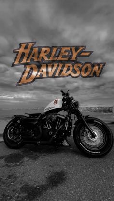 a black and white photo of a harley davidson motorcycle