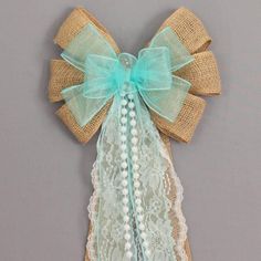 a decorative bow made out of burlock and lace