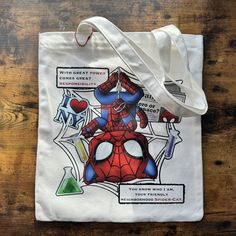 a spiderman tote bag on a wooden table