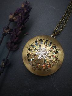 PLEASE read my shop announcement before placing an order so you know what to expect right now. Plus, when ordering from outside Europe, don't forget to provide a phone number for the courier to ensure the fastest and smoothest delivery. Perfect winter snowflake locket necklace: Victorian Vintage style locket necklace with a rhinestone snowflake adornment on its cover, and a sparkly crystal like resin cabochon inside, put there to let that magical glow be seen thru the filigree cutout cover. Perf Bronze Round Pendant Locket Necklace, Bronze Pendant Locket Necklace, Metal Pendant Locket Necklace Gift, Gold Spiritual Locket Necklace, Vintage Charm Locket Necklace With Flower Pendant For Gift, Bronze Locket Necklace As Gift, Handmade Silver Brass Locket Necklace, Bronze Locket Necklace For Gift, Filigree Locket Pendant Necklace For Gift