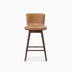 an upholstered stool with a brown leather seat and backrest, against a white background