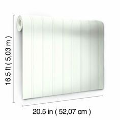 a white wall with vertical stripes on it and measurements for the width of the wall