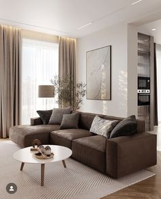 a living room with a couch, coffee table and large window in the back ground