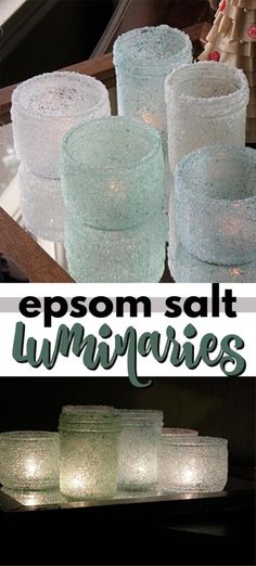 some glass candles sitting on top of a table with the words epsom salt luminaries