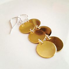 Triple Disc Earrings  Simple enough to wear every day, yet elegant for evening. Minimalist Cadmium-free Dangle Earrings, Yellow Gold Brass Round Disc Jewelry, Gold Sterling Silver Round Disc Earrings, Yellow Gold Brass Round Disc Earrings, Hammered Brass Round Disc Earrings, Elegant Semi-circle Brass Earrings, Earrings Circle, Earrings Everyday, Earrings Simple