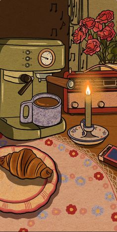 there is a croissant on the table next to a cup of coffee and a candle