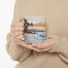 a woman is holding a coffee mug in her left hand and palm trees on the other side