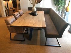 a wooden table sitting in the middle of a living room