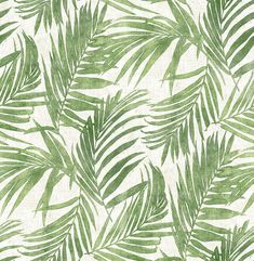 a green and white palm leaf print wallpaper with lots of leaves on the background