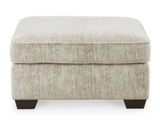 the foot stool is upholstered and ready to be used as a storage unit