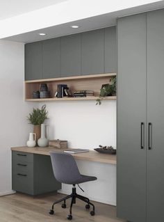 an office with grey cabinets and a desk