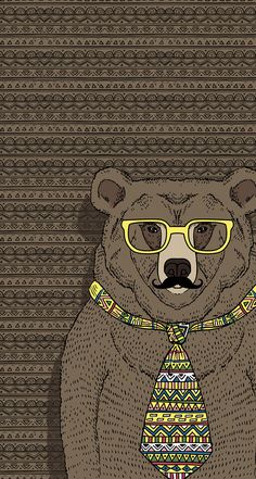 a brown bear wearing glasses and a neck tie with a pattern on it's chest