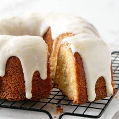 a bundt cake with white icing sitting on a cooling rack, ready to be eaten