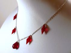 *Style: Early Art Deco Gorgeous Vintage Bohemian Czechoslovakian Sterling Silver Ruby Red Faceted Crystal Drop Necklace -4 faceted Rhombus Diamond shape and one faceted tear drop bead strung on a beautiful sterling silver chain link necklace. The front tear drop bead is a little darker red than the other four crystals. The piece measures 15.5 inches long and the chain is approximately 1.5-2 mm thick. The piece is in very good vintage condition! *Features:  A beautiful vintage dangle choker style Red Jewelry With Lobster Clasp For Party, Red Party Jewelry With Lobster Clasp, Red Beaded Chain Necklace Gift, Red Beaded Chain Necklace For Gift, Red Chain Necklace With Lobster Clasp As Gift, Gift Red Beaded Chain Necklace, Vintage Red Chain Necklace, Red Dangle Necklaces With Lobster Clasp, Red Ruby Beaded Necklaces For Jewelry Making