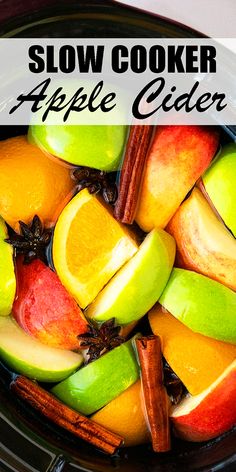 slow cooker apple cider recipe with apples, oranges and cinnamon in it