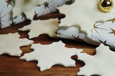 some white and gold christmas decorations on a table