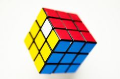 a rubik cube is shown on a white surface