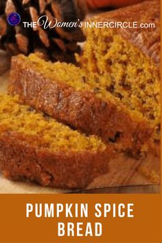 pumpkin spice bread is cut into slices and placed on a cutting board with pine cones in the background