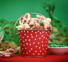 a red polka dot bucket filled with cookies