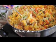 a pan filled with food sitting on top of a stove