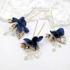 Beautiful and elegant, these delicate hand-wired hairpins are adorn with multiple white beads, silk flowers and pearls. The twisted wires are easy to adjust according to your most desired hair style. Sold as a set of 3 blue floral U-shaped hair pieces as pictured. The set makes a beautiful choice for a variety of occasions besides weddings. Match these adorable pieces to your outfit for the most feminine and chic spring fashion. DETAILS: Hand wired with fabric petals, pearls and beads. Sold as a set of 3 silk flower hairpins as pictured. Measures 4.7"L x 2.7"W. Flexible wires provide custom fit for the most desirable style MATERIALS: Metal nickel free wire, beads, fabric and pearls Blue Hairpin, Bridesmaid Blue, Fabric Petals, Pearl Bridesmaid Jewelry, Flowers And Pearls, Spring Fashion Chic, Beach Jewelry Boho, Bride Flower, Bridal Jewelry Necklace