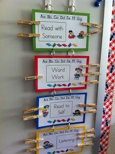 three bulletin boards hanging on the wall with clothes pins attached to them and some words written in different languages