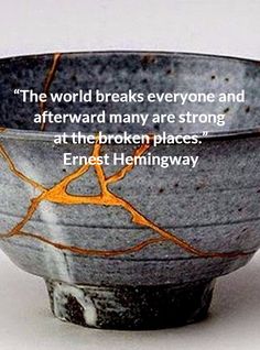 a black and white bowl with an orange design on the side, in front of a quote by frecklingway