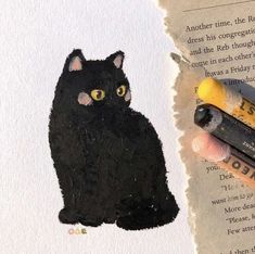 a drawing of a black cat with yellow eyes next to some crayon pencils