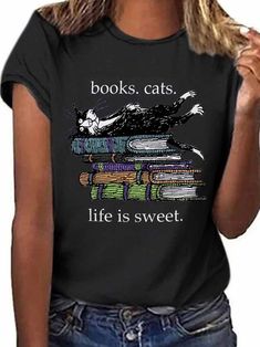 Cat & Book Graphic Tee Black Literary Top With Graphic Print, Literary Black Cotton T-shirt, Literary Style Short Sleeve Screen Print Tops, Black Literary Crew Neck T-shirt, Screen Print Short Sleeve Tops, Black Bookish T-shirt With Screen Print, Bookish Style Letter Print Summer Tops, Summer Bookish Tops With Letter Print, Black Literary T-shirt With Letter Print