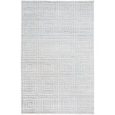 a white rug with squares and rectangles on the bottom, in front of a white background