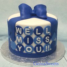 a blue and white cake with the words well miss you on it