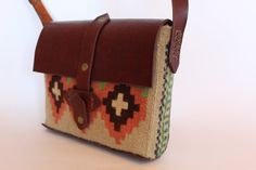 Handmade tapestry cross-body bag made with natural leather, natural wool thread, and natural colors, which we get from plants. The bag is an exclusive model and be sure, that there is no analog of it. It is distinguished by its healing properties because the material from which it is created is natural. The item is handmade and carries the positive energy that accompanies a handmade work of art. You will pair up with this bag for years and years because of the thickness of the material and the p Artisan Brown Shoulder Bag With Weaving, Ethically Sourced Brown Rectangular Shoulder Bag, Handmade Tapestry Shoulder Bag Rectangular, Brown Tapestry Satchel Shoulder Bag, Brown Tapestry Shoulder Bag With Leather Handles, Leather Hand-stitched Crossbody Shoulder Bag, Artisan Hand-stitched Crossbody Shoulder Bag, Vintage Hand-tooled Crossbody Shoulder Bag, Bohemian Hand-stitched Crossbody Bag