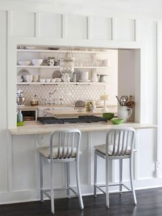 the kitchen is clean and ready to be used for dinner or coffee break with green accents