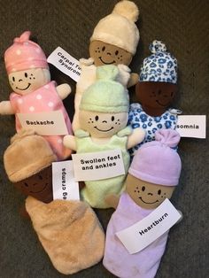 several stuffed animals with name tags on them sitting next to eachother's names