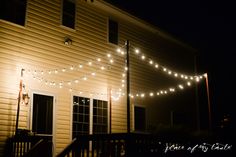 string lights are strung on the outside of a house