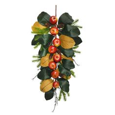 an arrangement of berries and leaves hangs on a wall ornament for the holiday season