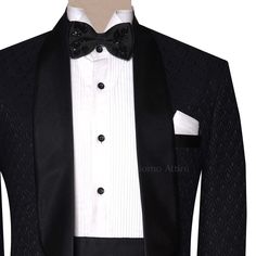 Elevate your formal attire with this superb pure karandi black tuxedo suit. Crafted with meticulous interest to element, this custom-made masterpiece features difficult embroidery and a wonderful match. Perfect for special occasions, weddings, or black-tie occasions, this tuxedo exudes timeless beauty and sophistication. Elegant Fitted Black Set, Elegant Black Fitted Sets, Black Double Breasted Suit For Party With Suit Collar, Black Tailored Wedding Tuxedo, Black Tailored Tuxedo For Wedding, Black Double Breasted Suit For Party, Black Double-breasted Suit With Suit Collar For Party, Designer Semi-formal Sets With Suit Collar, Luxury Semi-formal Three-piece Suit With Long Sleeves