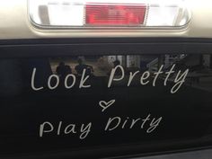 the back end of a car that says, look pretty play dirty