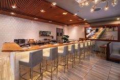 an empty restaurant with several bar stools