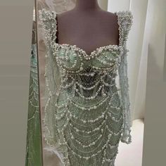 a dress made out of beads on display