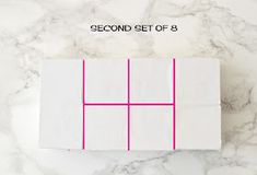 a piece of white paper with pink squares on it and the words second set of 8