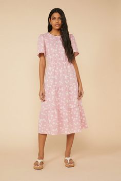 For a grown up take on flower power, opt for this tiered midi dress in an all over daisy print. Complete with a cinched in waist and wide short sleeves, perfect for garden parties or picnics in the park. Garden Parties, Pink Midi Dress, Daisy Print, Grown Up