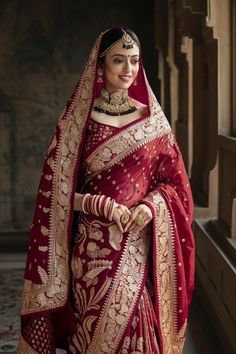 a woman in a red and gold sari