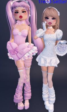 two dolls are dressed up and posing for the camera