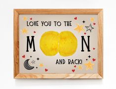 a wooden frame with an image of two lemons and the words love you to the moon and back