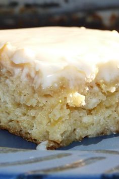 a close up of a piece of cake with frosting on it's top