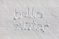 the word hello winter written in snow