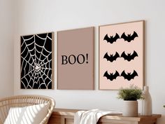 three posters with bats hanging on the wall next to a wicker chair and potted plant