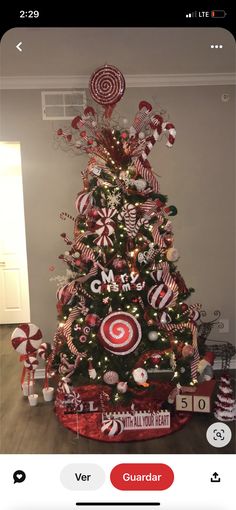 a christmas tree decorated with candy canes and lollipops for the holiday season